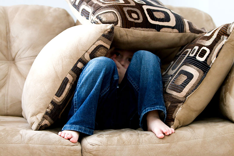 mental-health-foundation-blog-post-helping-childrens-covid-19-anxiety-photograph-of-kid-hiding