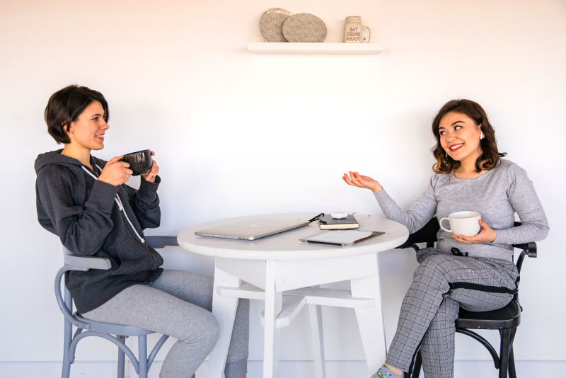mental-health-foundation-blog-post-mental-health-awareness-month-2021-picture-of-women-sitting-having-coffee-800x534
