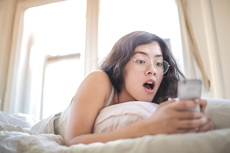 mental-health-foundation-blog-post-mental-health-and-social-media-picture-of-girl-on-phone-in-bed-800x534