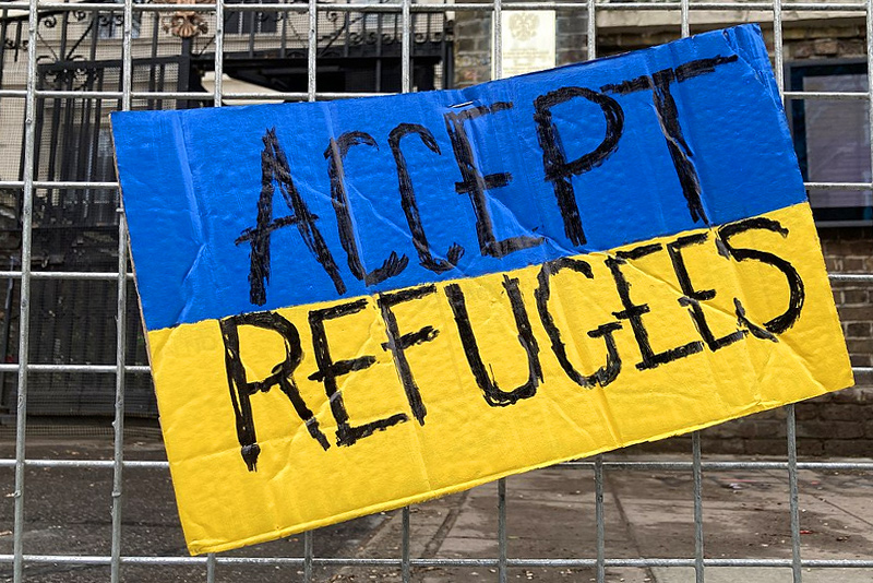 mental health foundation articles how to help ukrainian refugees image of poster reading accept refugees stuck to a fence
