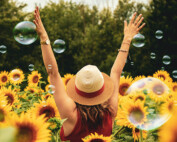 mental-health-foundation-articles_mental-health-awareness-2023-picture-of-lady-in-field-of-sunflowers
